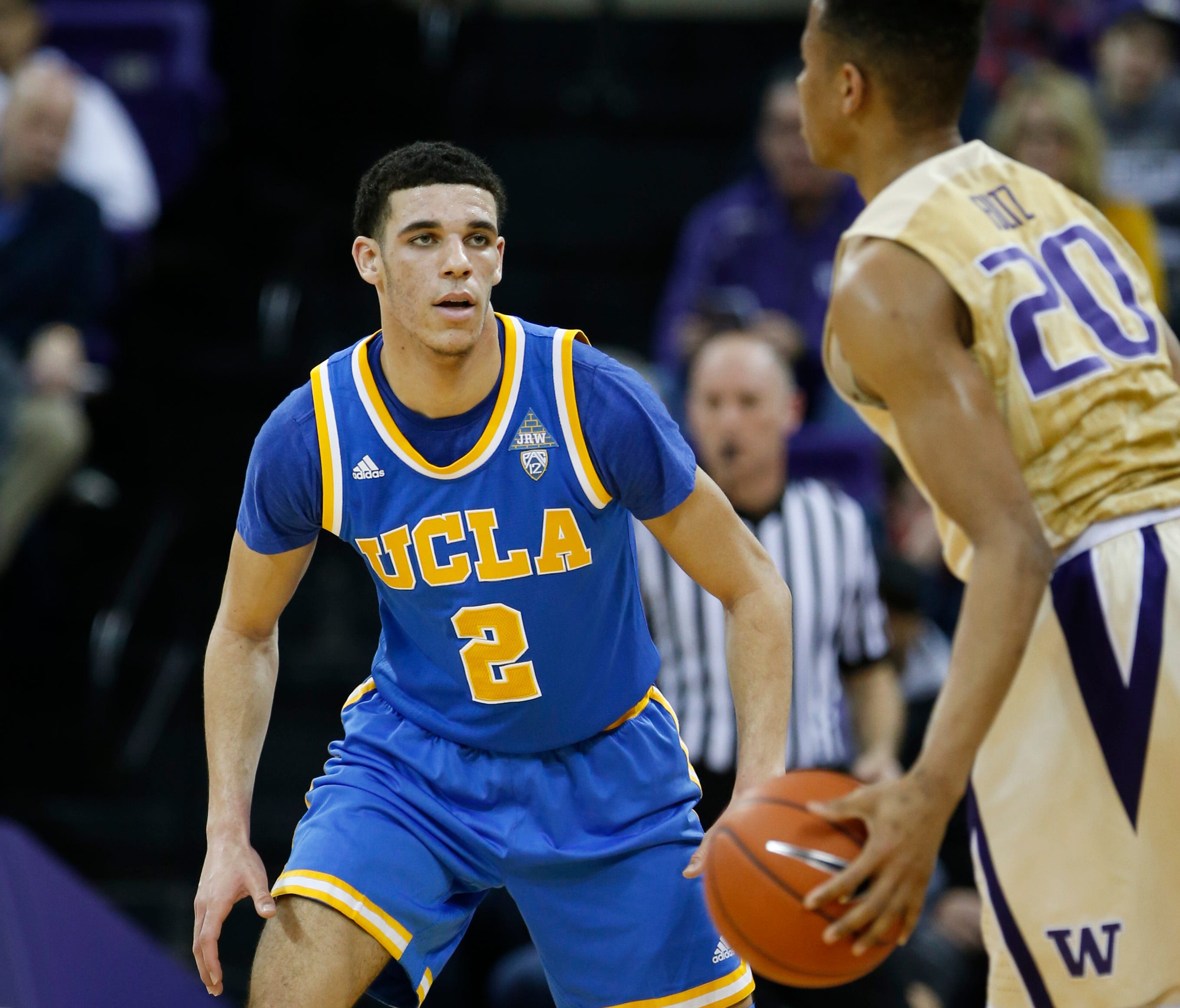 UCLA Bruins guard Lonzo Ball (2) guards Washington Huskies guard Markelle Fultz (20) during the 2016-17 college basketball season.