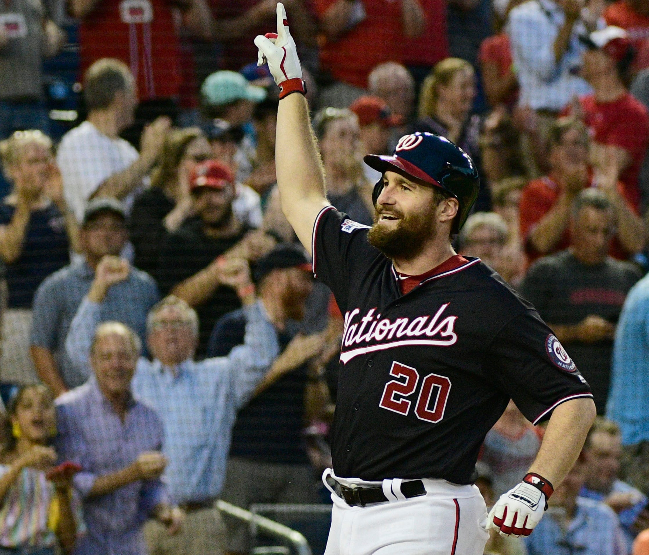 Washington Nationals second baseman Daniel Murphy (20) celebrates after hitting a three-run home run during the third inning against the New York Mets at Nationals Park.