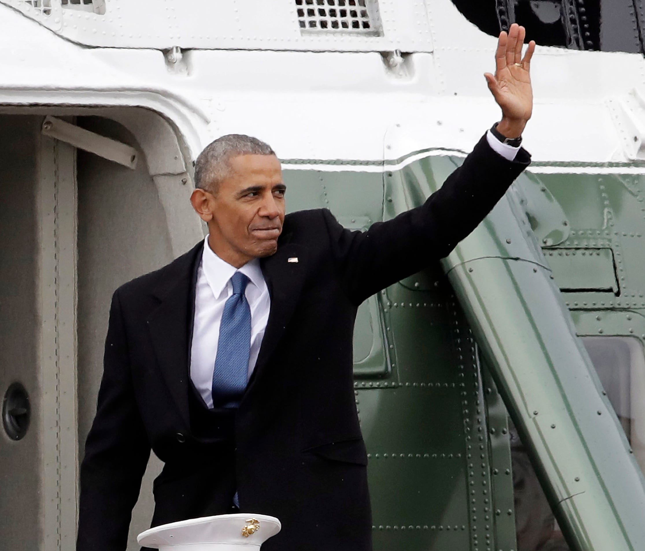 In this Jan. 20, 2017, file photo, former President Barack Obama waves as he boards a Marine helicopter during a departure ceremony on the East Front of the U.S. Capitol in Washington after President Trump was inaugurated.