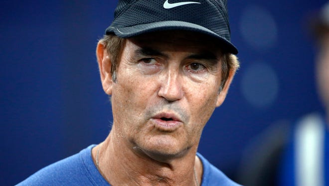 FILE - In this Sept. 25, 2016, file photo, former Baylor football coach Art Briles watches the Dallas Cowboys and the Chicago Bears warm up for an NFL football game in Arlington, Texas. Cleveland Browns coach Hue Jackson defended inviting Briles to work with his team. Briles was fired by the school in May amid a sexual assault scandal involving several former football players. He attended Cleveland’s practice Wednesday, Oct. 12, at the request of Jackson, who also had Briles as a guest during training camp and asked him back. (AP Photo/Ron Jenkins, File)