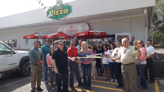 Owners Jim and Debbie Nennich cut the ribbon for the grand opening of TGI Pizza, 801 North Hudson Street in Silver City on Friday. The Silver City/Grant County Chamber of Commerce held a ceremony for the new business. Restaurant employees, Chamber members, and friends attended the ceremony. The restaurant is also home to TGI Yogurt.