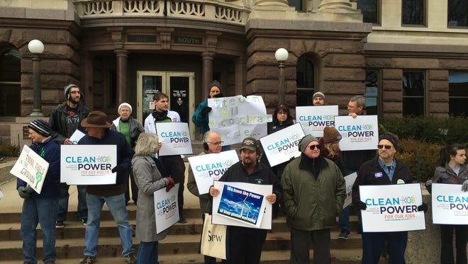 About 20 conservationists held a rally on the steps of the Brown County Courthouse Friday.
