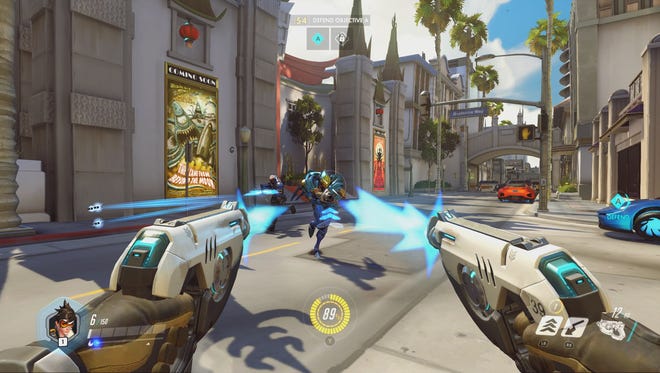 Tracer shoots at enemies in a scene from 'Overwatch.'