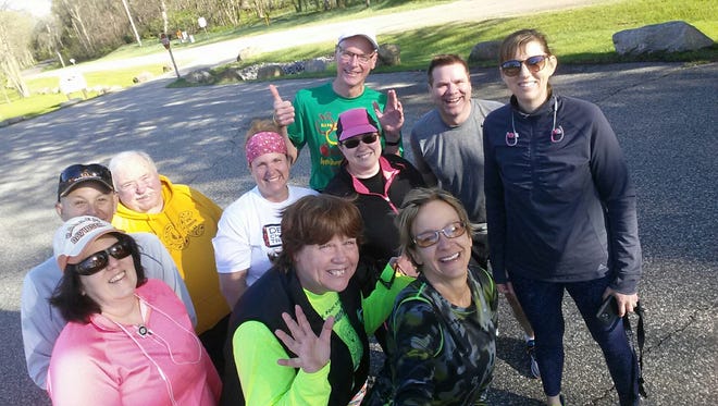The Adams County Running Club starts each workout with a photo. I'm in the back in the gray. I don't like my photo taken, but that is a genuine smile.