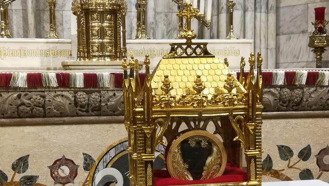 The 150-year-old heart of St. John Vianney is displayed at St. Patrick's Cathedral in New York. Saturday, April 6, 2019. The French priest helped hide priests on the run during the French Revolution. The tradition of venerating the body parts of saintly Catholics goes back to the Middle Ages in Italy. (AP Photo/Julie Walker)