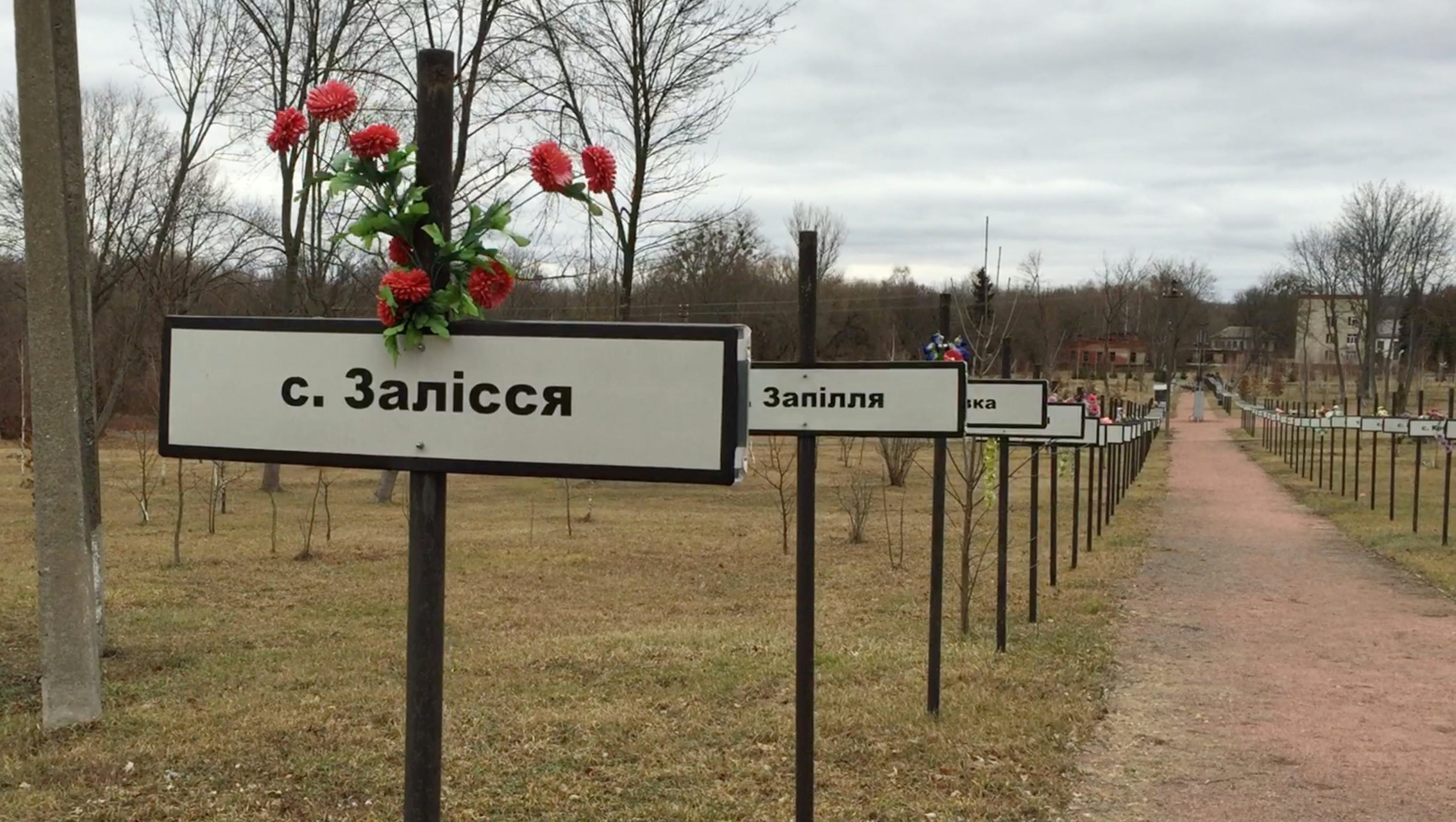 Memorials for villages in Ukraine that were abandoned because of the nuclear disaster.