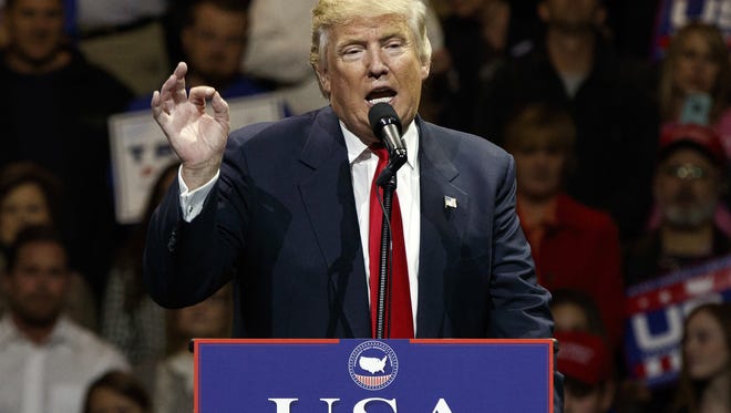 President-elect Donald Trump gestures as he speaks during a "USA Thank You" tour event in Cincinnati.