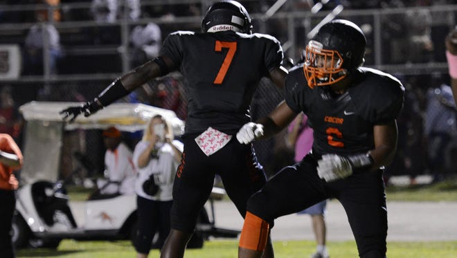 Timmy Pratt (2) and Juwan Armstrong of Cocoa celebrate a Pratt TD during Friday's game against Cocoa.