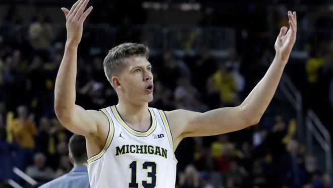 Michigan Wolverines forward Moritz Wagner pumps up the crowd after a three-pointer in the first half against Indiana on Thursday, Jan. 26, 2017 in Ann Arbor.