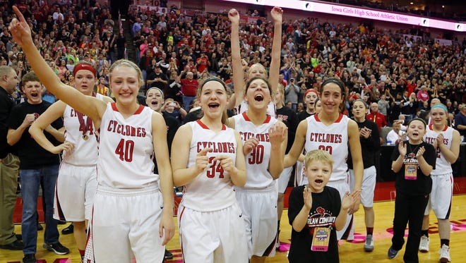 The Harlan girls celebrate winning the Class 4-A state championship title against Western Dubuque at Wells Fargo Arena on Saturday.