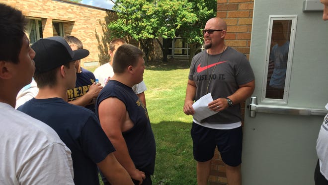 Capac football Coach Bill Nestle talks with his team during a recent practice.