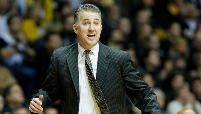 Purdue coach Matt Painter shouts instructions to the Boilermakers as they take on Ohio State Tuesday, December 31, 2013, in Mackey Arena.