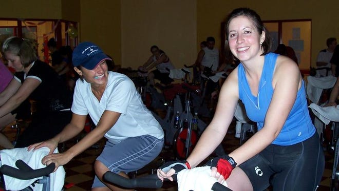 Fitness buffs take part in a Cycle of Hope event at the Rochester Athletic Club in Greece in this 2009 photo.