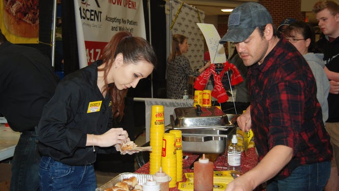 Dickey's Barbecue Pit in Nixa serves up barbecue samples at the NIXPO Business and Community Expo on Saturday.