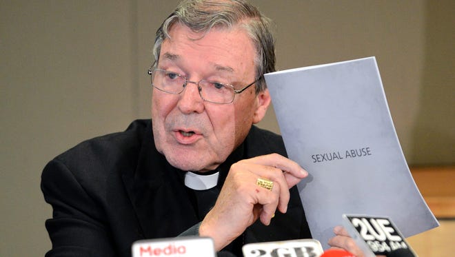 Australia's Cardinal George Pell holding the response of the Catholic archdiocese to sexual abuse during a press conference on November 13, 2012 in Sydney.  An Australian crowdfunding campaign to send victims of child sex abuse to Rome to hear Vatican finance chief George Pell give evidence to an inquiry has been overwhelmed by support on February 17, 2016, doubling its target in two days.  Cardinal Pell, formerly the top Catholic official in Australia, is too ill to travel to the Victorian town of Ballarat to appear in person at a Royal Commission and is expected to give evidence via video-link from Rome. 