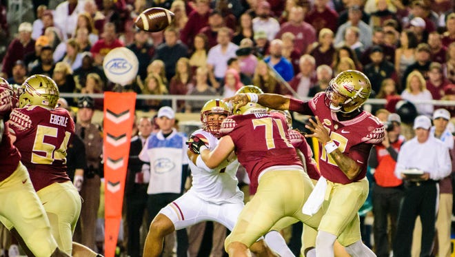 Deondre Francois (12) throws a pass during the 45-7 Florida State University victory against Boston College on Fri., Nov. 11, 2016 at Doak Campbell Stadium, in Tallahassee, FL.