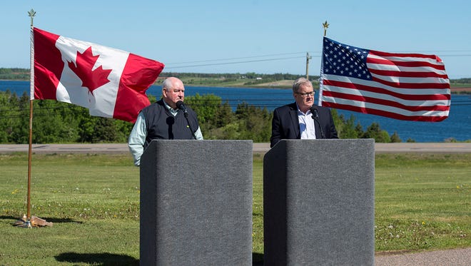 Agriculture Minister Lawrence MacAulay, right, and U.S. Secretary of Agriculture Sonny Perdue talk with reporters at MacAulay's farm in Midgell, Prince Edward Island, Canada, on Friday, June 15, 2018.