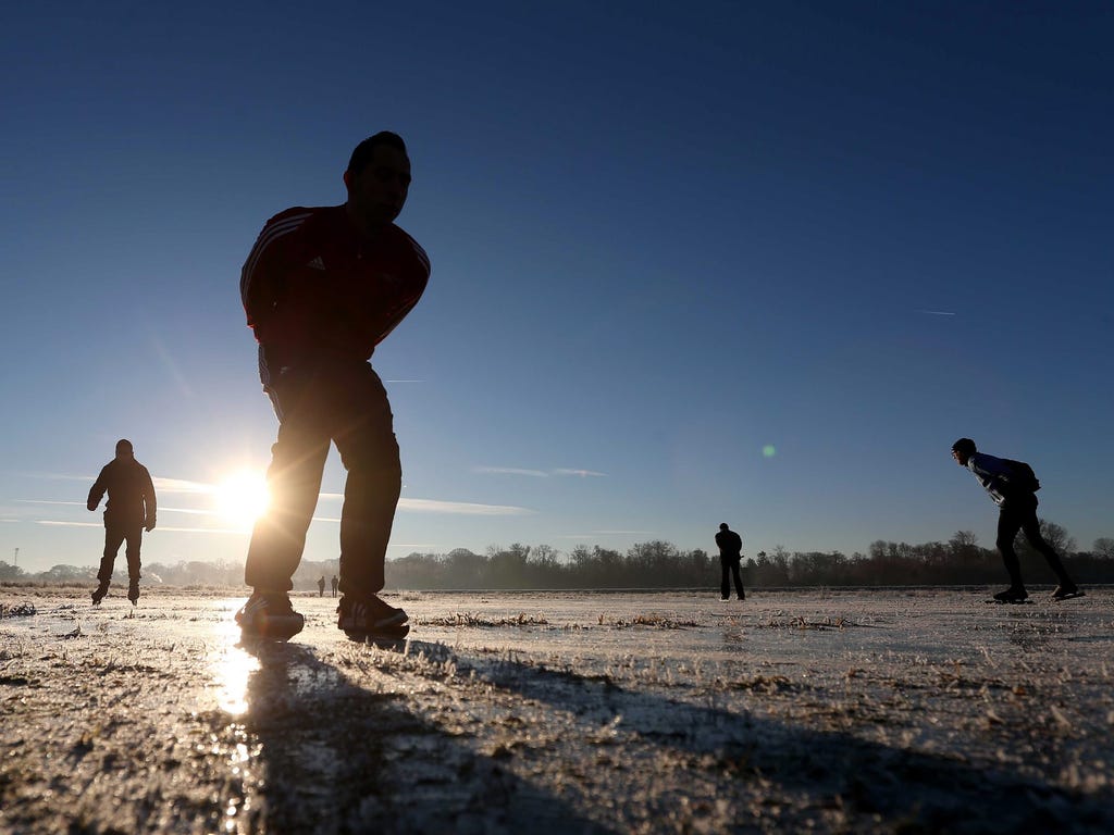 Dutch skaters zip around on natural ice for the first time this year in Tietjerk, Netherlands.
