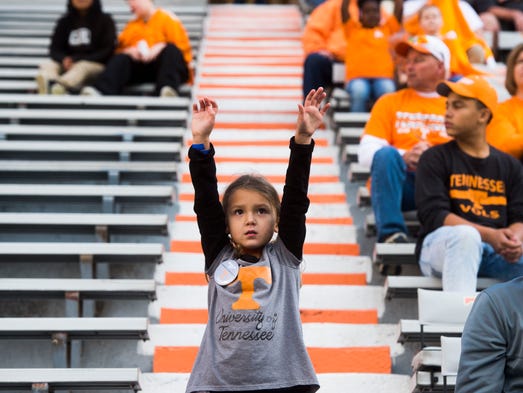 A young Tennessee fan hopes to catch the ball before
