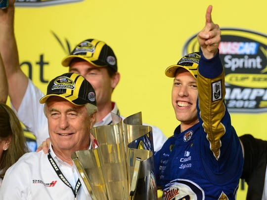 NASCAR Sprint Cup Series driver Brad Keselowski (right) and team owner Roger Penske celebrate after winning the 2012 championship.