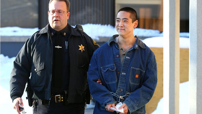 Charles Tan becomes emotional as he is led out of Pittsford Town Court after a hearing was waived when he was indicted by a grand jury on charges related to the death of his father.