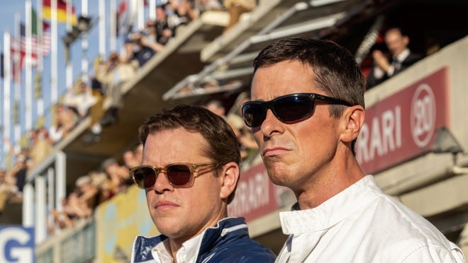 This image released by 20th Century fox shows Christian Bale, right, and Matt Damon in a scene from "Ford v. Ferrari," in theaters on Nov. 15. (Merrick Morton/20th Century Fox via AP)