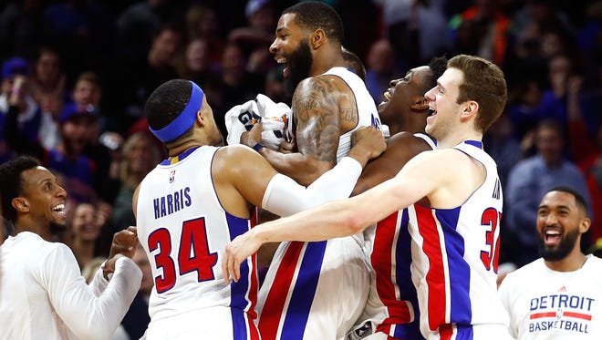 Pistons forward Marcus Morris celebrates his buzzer-beating game-winning shot with teammates to beat the Washington Wizards, 113-112, at the Palace on Saturday.