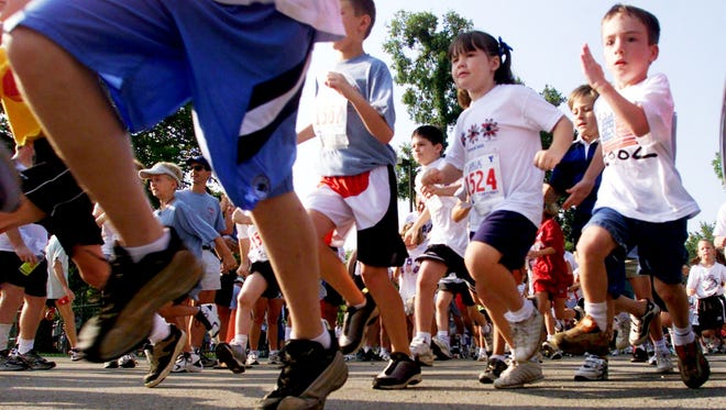 Children take off at the start of a previous half-mile race for kids at the Maryland Farms YMCA in Brentwood.