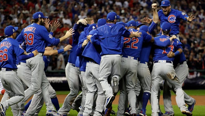 The Chicago Cubs celebrate after Game 7 of the Major League Baseball World Series against the Cleveland Indians Thursday, Nov. 3, 2016, in Cleveland. The Cubs won 8-7 in 10 innings to win the series 4-3.