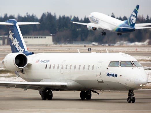 A SkyWest Bombardier CRJ taxies for departure as an