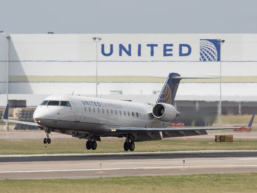 A United Express CRJ regional lands at Denver International