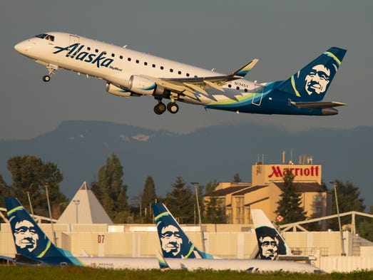 An Alaska Airlines Embraer E170 takes off over company