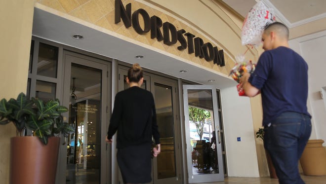File photo taken in Feb. 2017 shows visitors near the entrance to a Nordstrom store in Miami, Florida.