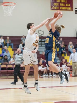 Greencastle-Antrim’s Bryan Gembe (32) puts up a shot