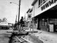 Shoppers cross makeshift bridges to reach stores on