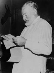 Dated 1952: American writer Ernest Hemingway learning