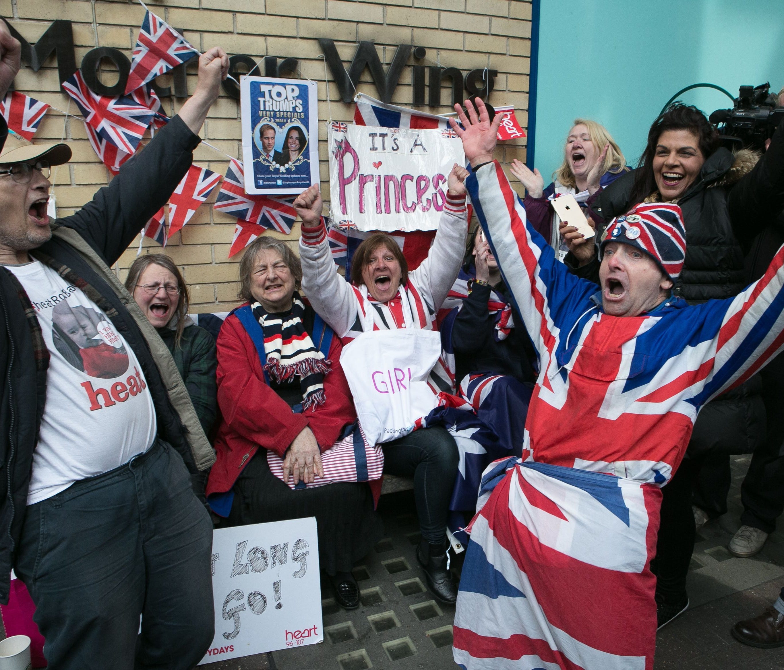 Royal fans and well wishers react after Kensington Palace announced that Duchess Kate of Cambridge gave birth to Princess Charlotte at St. Mary's Hospital, London, May 2, 2015.