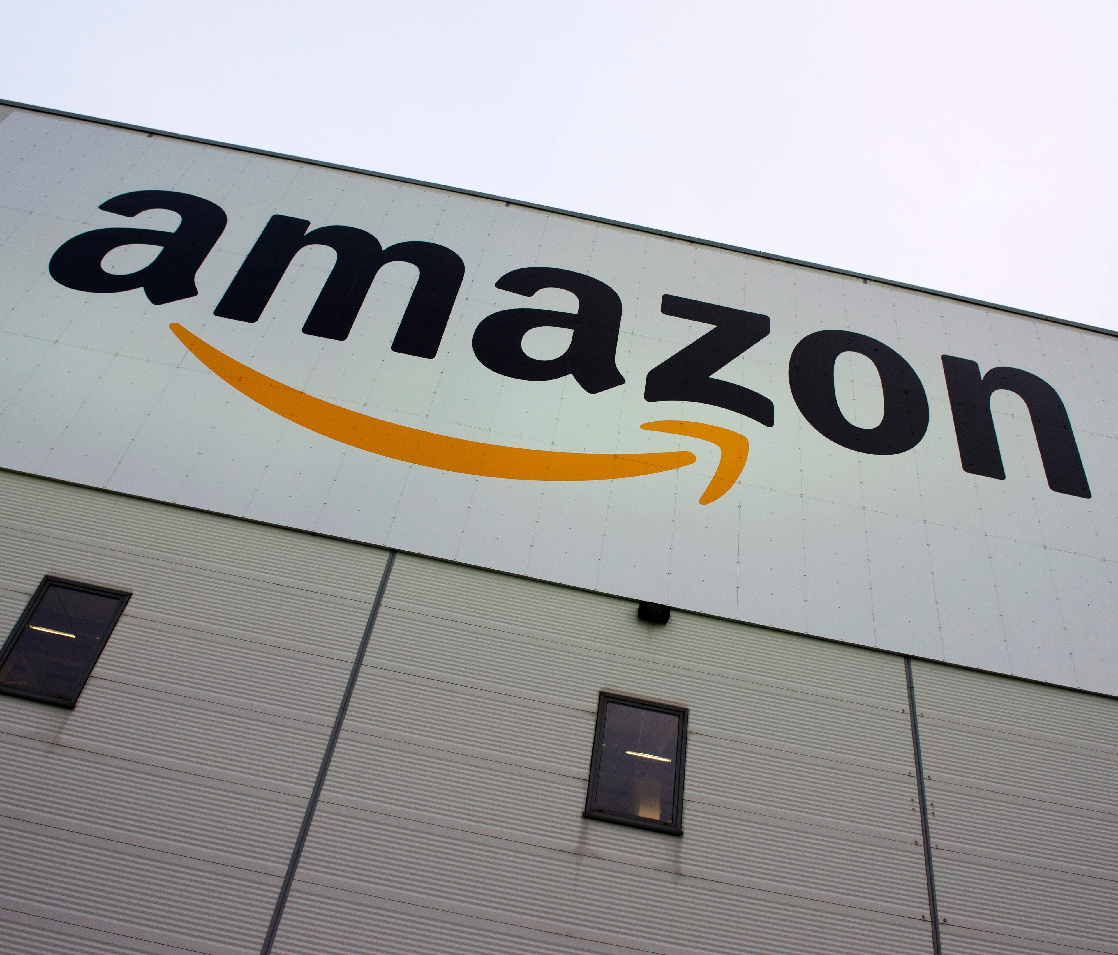 The Amazon logo appears on the company's logistics center in Brieselang, Germany, west of Berlin.