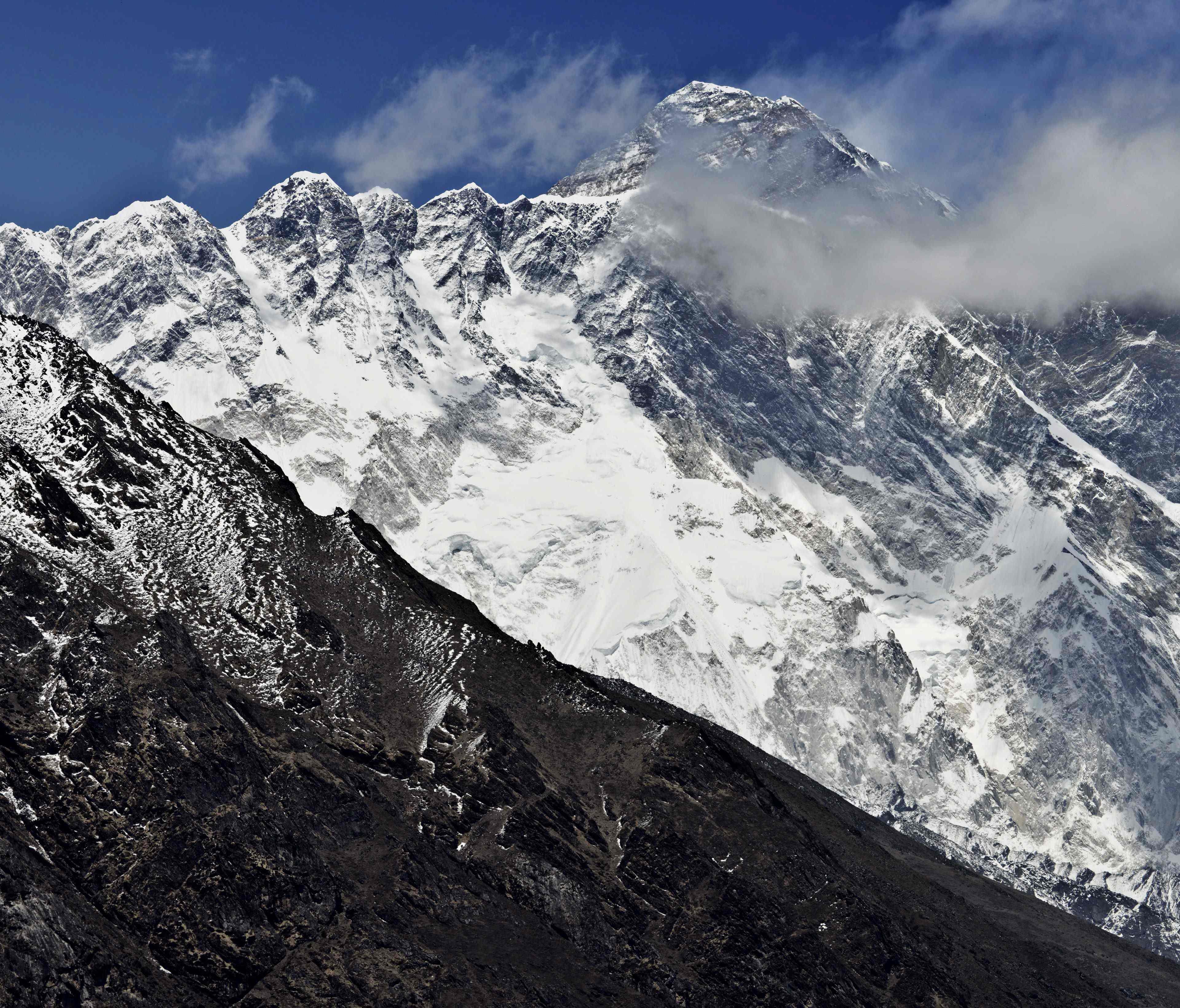 Mount Everest is seen in the background from the village of Tembuche in the Kumbh region of north-eastern Nepal.