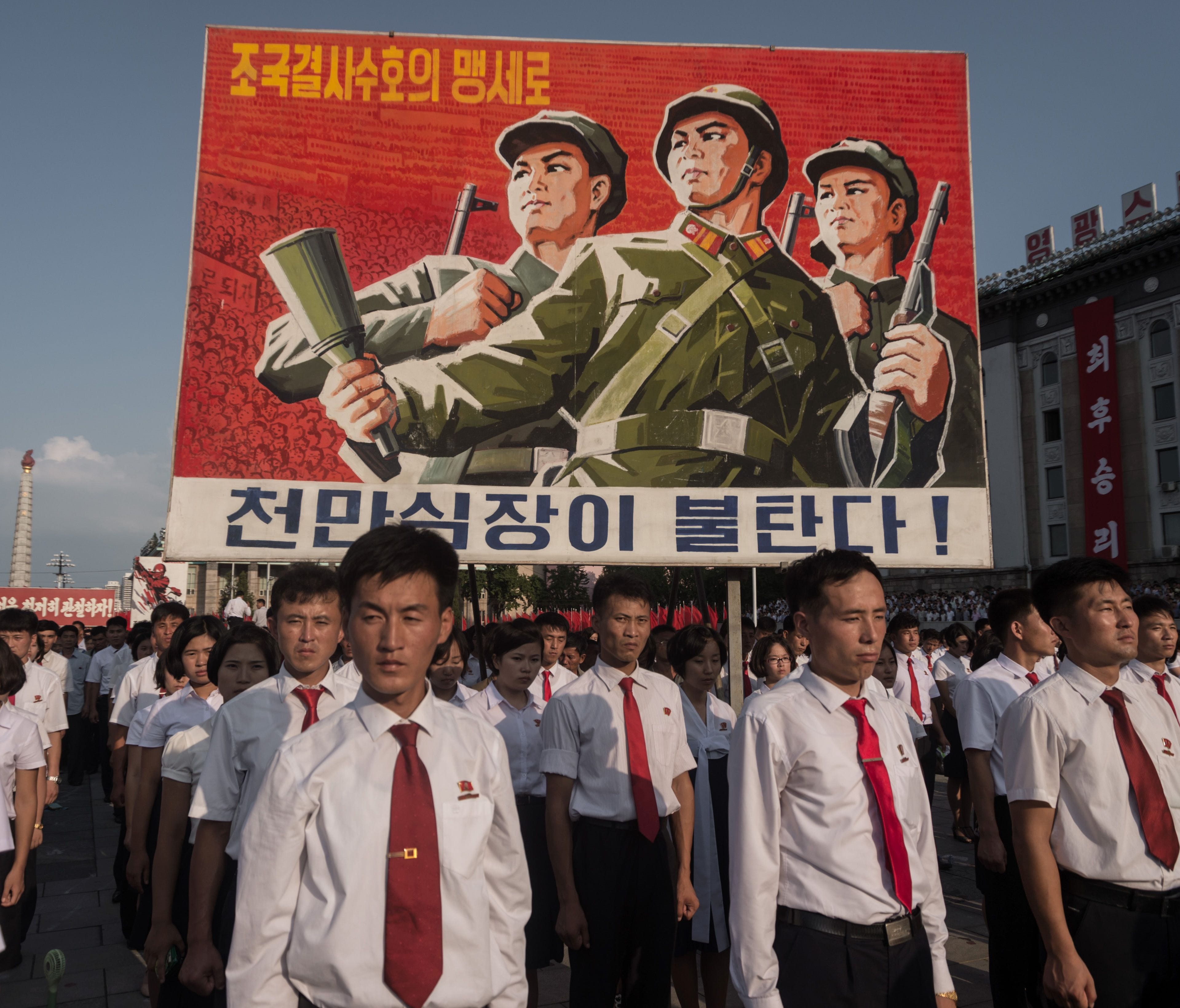 A propaganda poster is displayed during a rally in support of North Korea's stance against the U.S., on Kim Il-Sung square in Pyongyang on Aug. 9, 2017. U.S. President Donald Trump said the United States' nuclear arsenal was 
