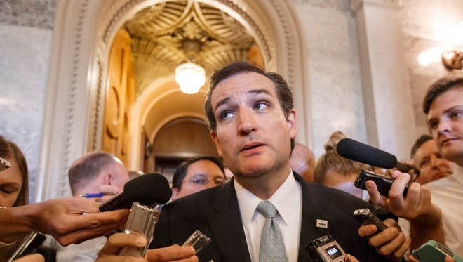 Sen. Ted Cruz, R-Texas, emerges Wednesday after his overnight filibuster against ObamaCare.
