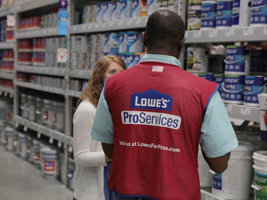 Lowe's employee helping a customer