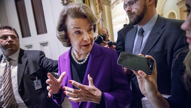 Senate Intelligence Committee Chair Sen. Dianne Feinstein, D-Calif. speaks to reporters on Capitol Hill in Washington, Tuesday, Dec. 9, 2014, as she leaves the Senate chamber after releasing a report on the CIA's harsh interrogation techniques at secret overseas facilities after the 9/11 terror attacks.