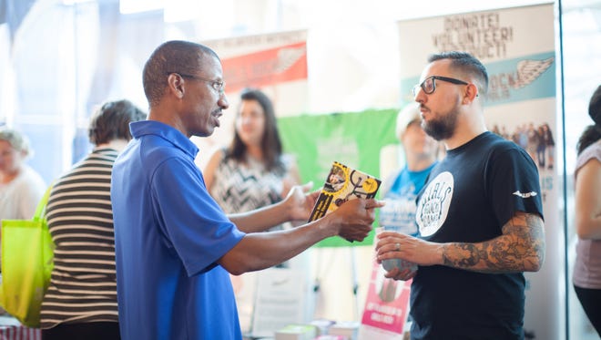 Young professionals connect at IndyVolved. This year's event is June 9 at Indianapolis Central Library.