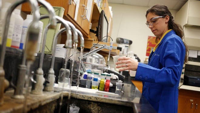 4/29/16 10:33:18 AM -- Louisville, KY  --   Nicole Estes performs a water quality analysis in a laboratory at the Louisville Water Company's Crescent Hill filter plant on Friday, April 29, 2016 in Louisville, KY.   Looking at the differences and similarities between large, medium and small water systems. It will get into how they monitor for lead and reduce levels in water, and showcase differences in facilities, qualifications for operators, etc. It will run with upcoming stories in the "Lead in Your Water" project.   This photo/video request is for the large water system example -- the Louisville Water Company, which serves about 850,000 people.  There will be two other locations that will be shot for this video. --    Photo by Luke Sharrett, Freelance ORG XMIT:  LS 134833 Video and photo  04/29/2016 [Via MerlinFTP Drop]
