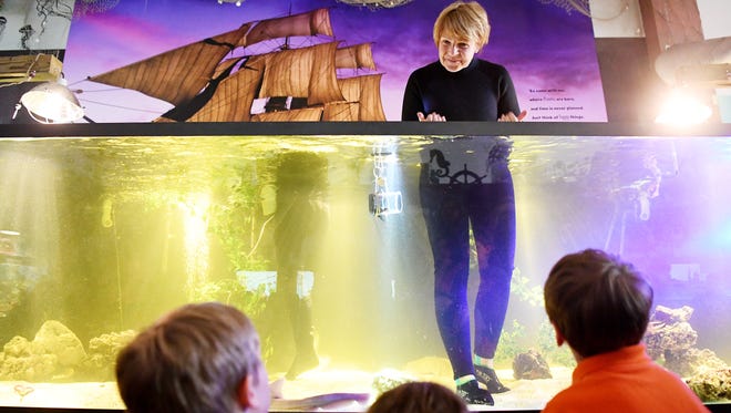 B.J. Ramer, founder and executive curator of Team ECCO Aquarium and Shark Lab, answers questions from children after hatching a shark pup May 16, 2018.