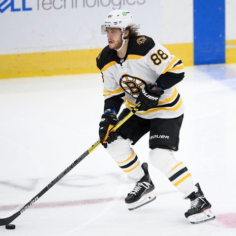 Boston Bruins right wing David Pastrnak (88) skate