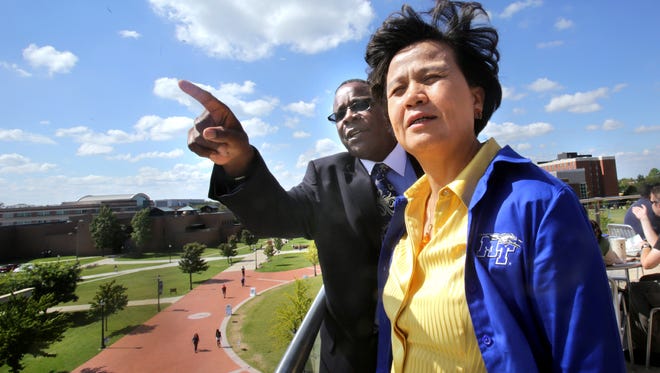 MTSU President Sidney A. McPhee points out different areas of interest for Vice Minister Xu Lin of China at the university in 2013. They toured the MTSU Confucius Institute.