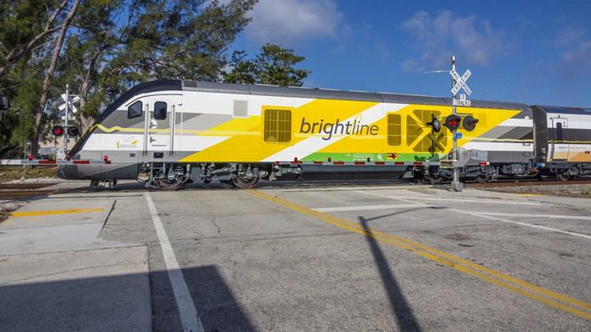 A Brightline train crosses Park Place Friday, March 2, 2018.
