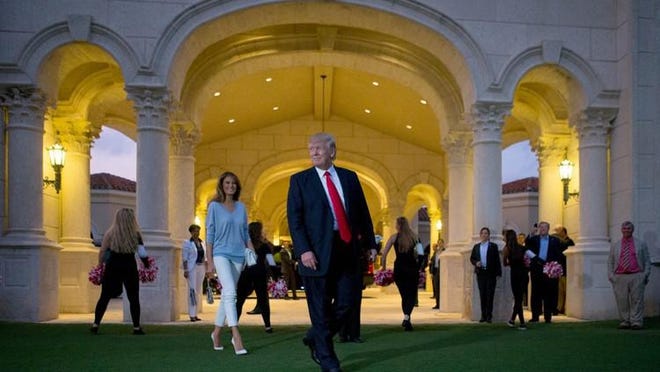 President Donald Trump and his wife Melania are welcomed to Trump International Golf Club by the Palm Beach Central band. Trump watched the Super Bowl at his club in 2017.